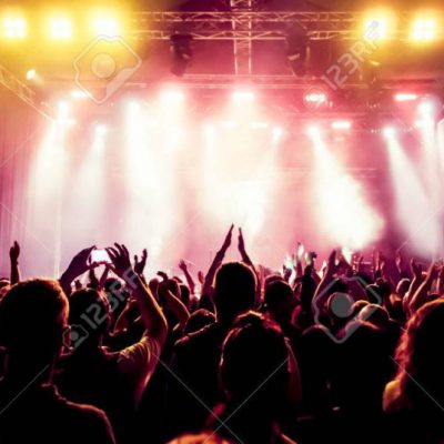 29458457-silhouettes-of-concert-crowd-in-front-of-bright-stage-lights
